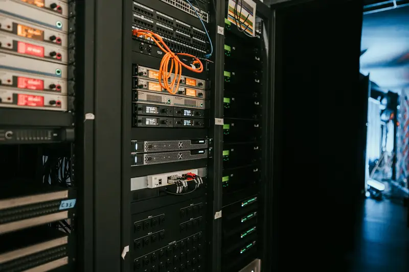 Racks of servers with patch cables in a data centre