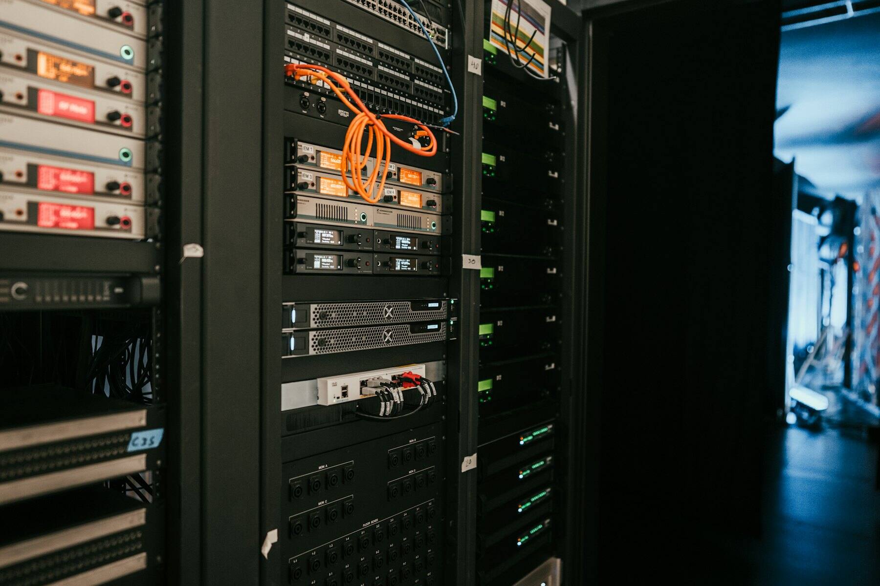 Racks of servers with patch cables in a data centre