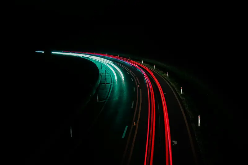 Long-exposure light trails on a motorway at night