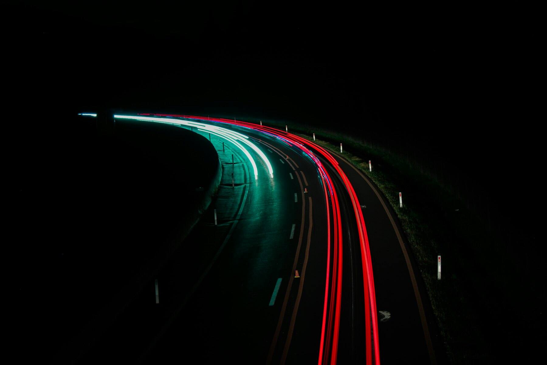 Long-exposure light trails on a motorway at night